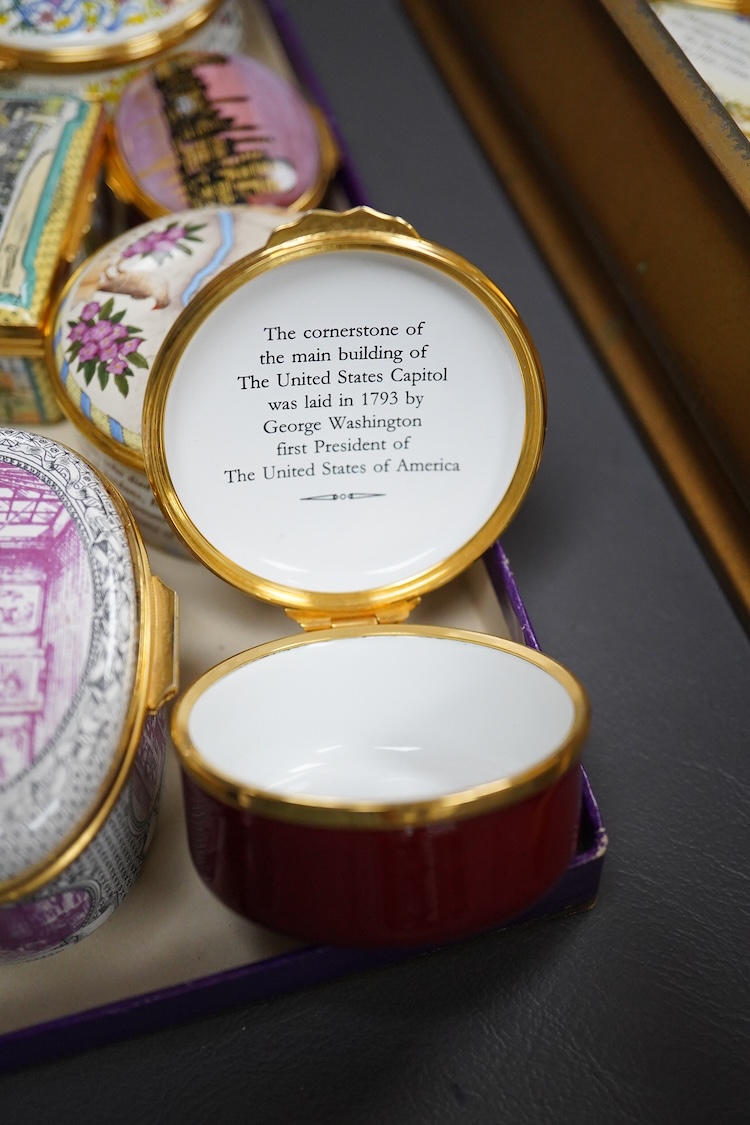 Eighteen Halcyon days enamel boxes and an enamel egg shaped box on stand